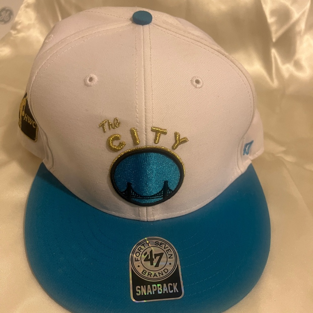 The City Golden State Warriors
Baseball Cap Hat White and Blue with Gold Accents